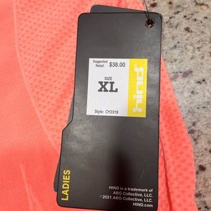 Multiple ladies xl exercise shirts, 2 green 1 pink 1 salmon.